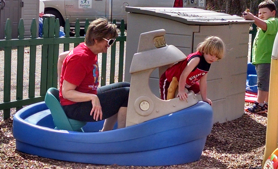 Child learning through play with staff