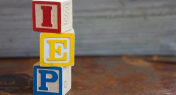 Stack of blocks on a table spelling out I E P